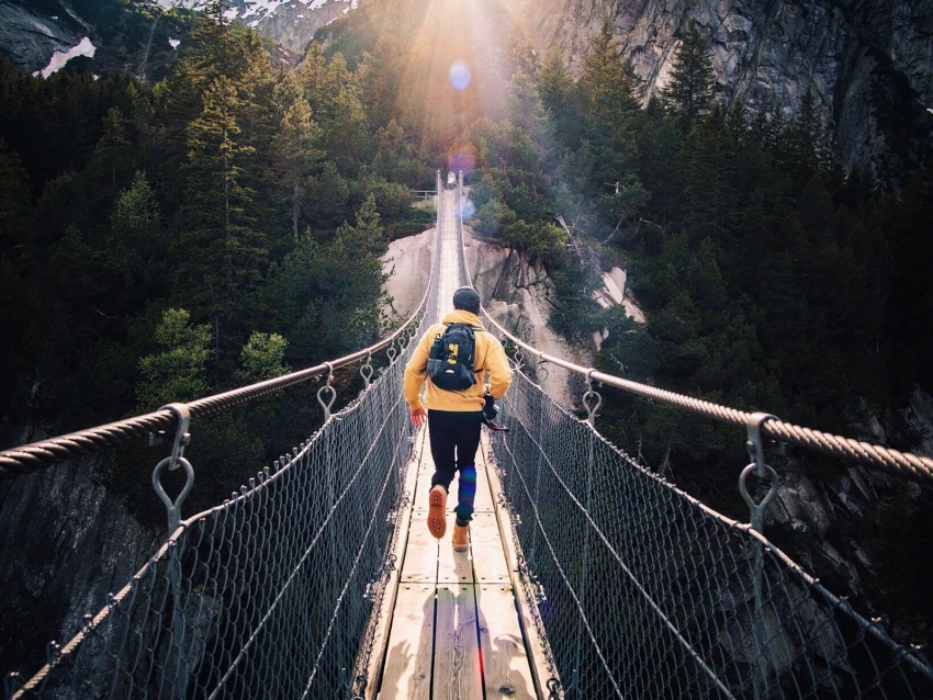 bridge, man, mountains, sunlight, switzerland