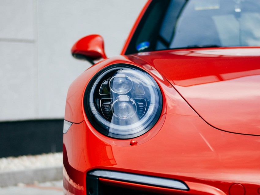 Car Red Front View Headlight Closeup Background