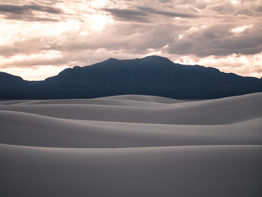 white sand dunes, desert landscape, dramatic sky, mountain backdrop, nature photography