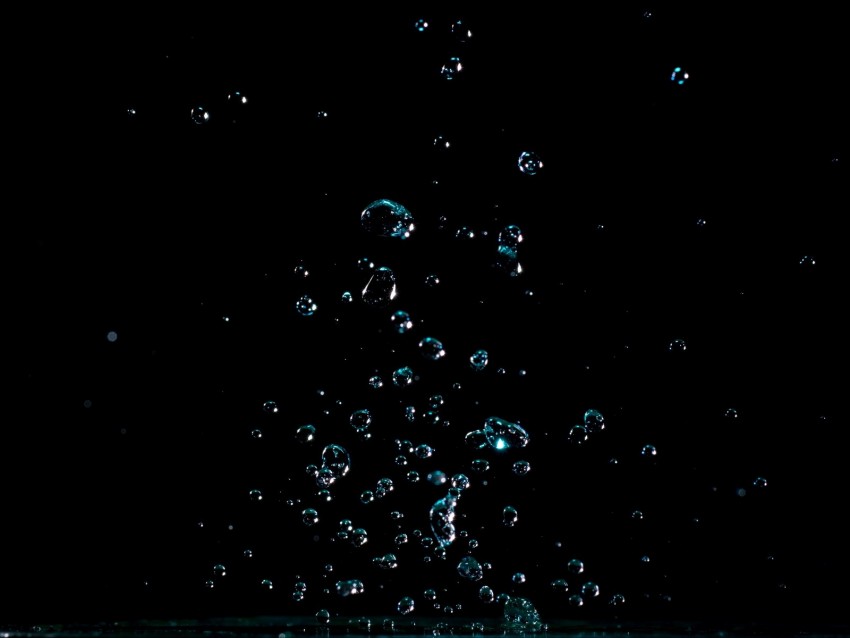 water droplets, splash effect, black background, liquid motion, photography