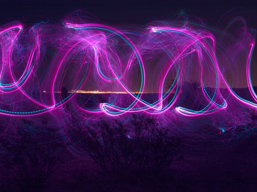 light trails, night photography, colorful long exposure, abstract patterns, desert landscape