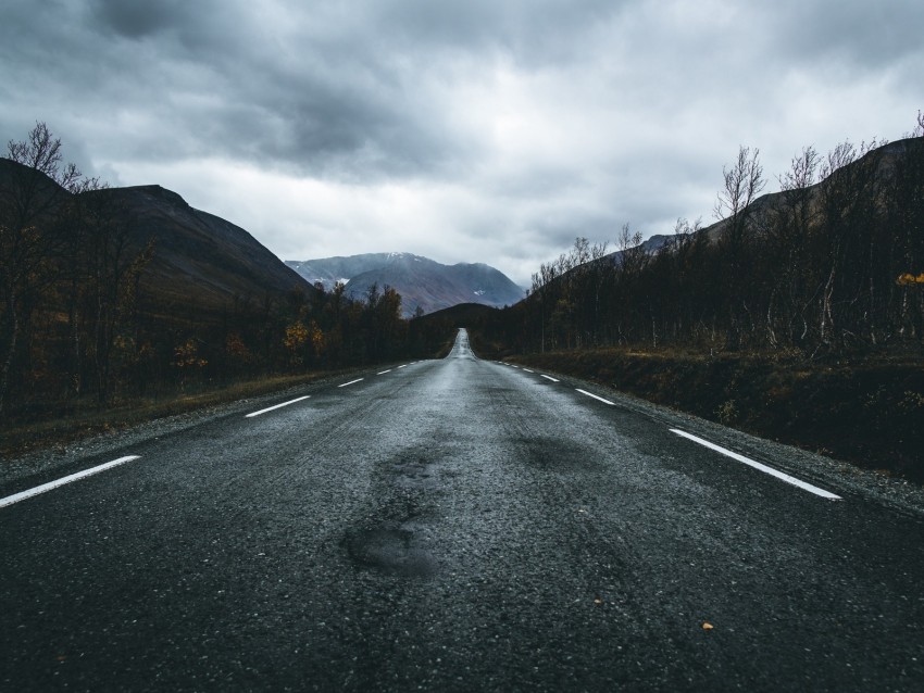 open road, scenic landscape, cloudy sky, mountain view, autumn trees