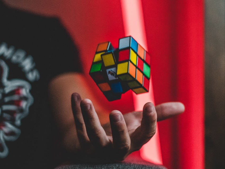 Rubiks Cube Hand Levitation Colorful Background