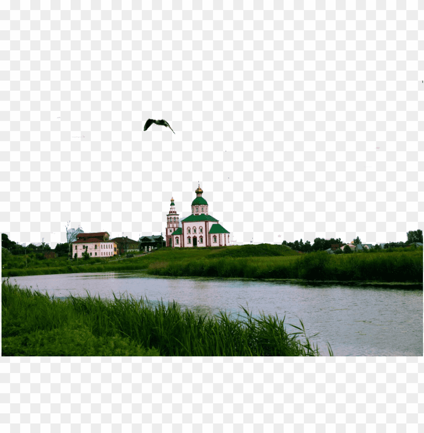 Scenic view of a church beside a river with green grass foreground PNG