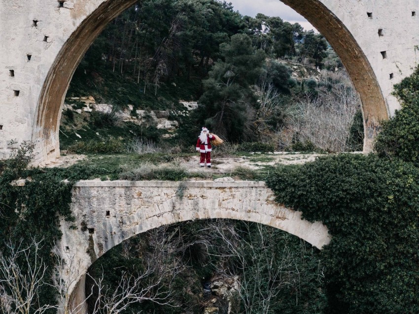 santa claus, bridge, arch, costume, bag, cliff, trees