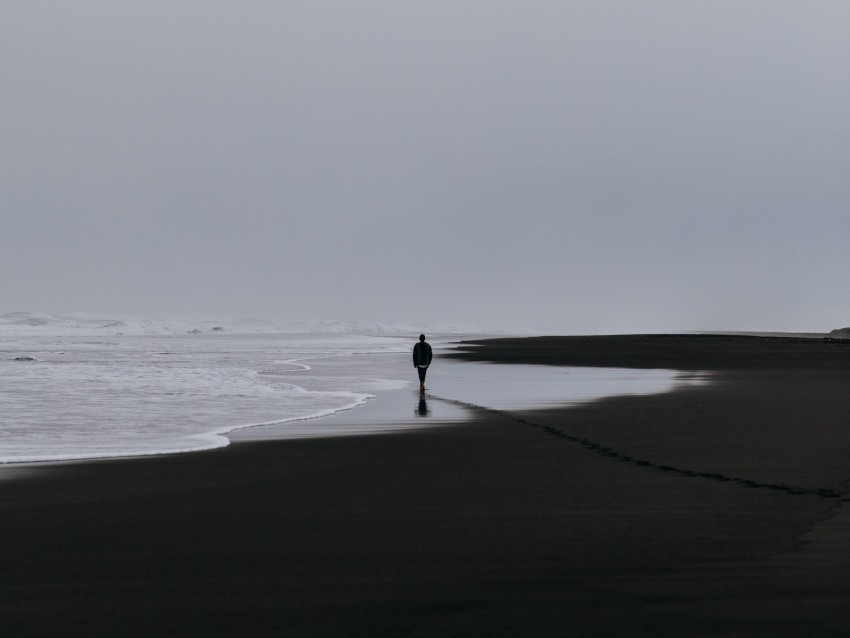 solitary figure, beach walk, gray skies, coastal scenery, tranquil landscape