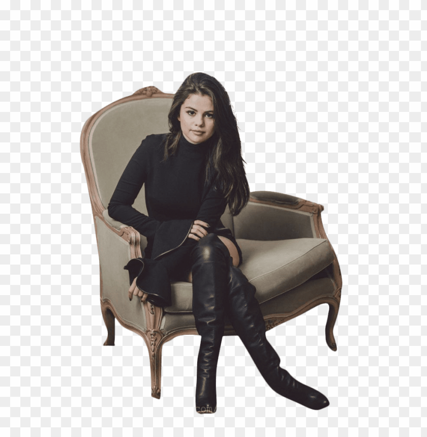 Woman in black outfit sitting on an ornate chair, stylish fashion photography.