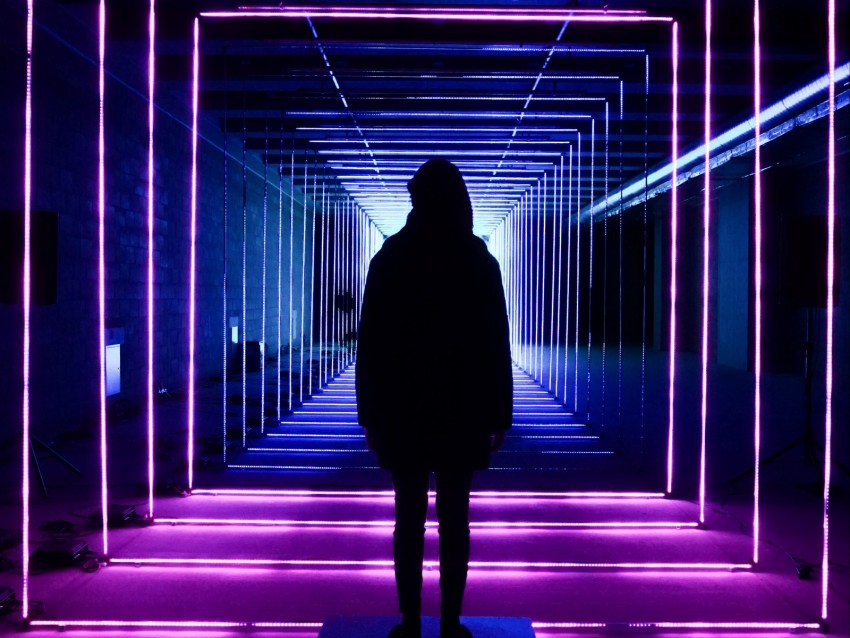 neon light installation, illuminated hallway, silhouette art, contemporary design, immersive experience